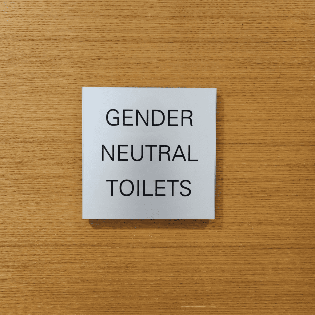 Sign on the door of a gender neutral restroom